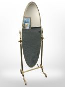 A contemporary brass cheval mirror,
