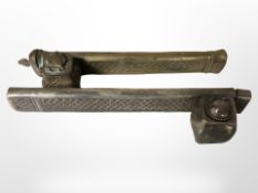 An oriental white metal pen holder/ink well, and a similar brass example, length 23cm.