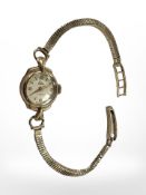 A lady's 9ct gold Elco wristwatch on 9ct gold integral bracelet.