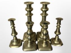 Three pairs of Victorian brass candlesticks, tallest 25.5cm.