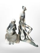 A large Nao figure of a musician with lute, and a further figure of a seated lady,