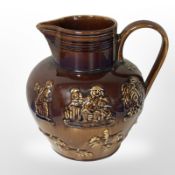 An Arthur Wood Lambeth Ware six-pint jug, together with a pottery jardiniere, height 26cm.