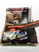 A group of Flymo tools, hand-held vacuum, digital clock radio, assorted board games, dominoes,