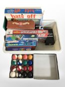 A group of board games, boxed set of pool balls, etc.