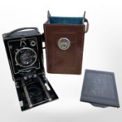 A Zeiss Icon vintage camera with Carl Zeiss lens, F=13,5cm, in brown leather case.