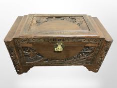 A Chinese carved camphor wood chest, 93cm w x 49cm d x 52cm h.