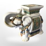 A ceramic elephant plant stand, height 39cm.