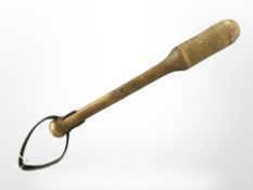 A 19th century turned wooden cosh with leather hand strap, length 38cm.