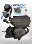An Olympus Camedia E-20P with Olympus Lens AF Zoom 62mm, comes with battery charger,