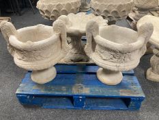 A pair of concrete twin-handled urn planters, height 51cm.