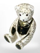 A Royal Crown Derby seated Harrods teddy bear paperweight with silver stopper,