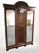 A late Victorian mahogany and satin wood triple door compactum wardrobe,