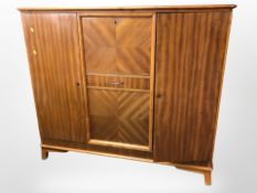 A 20th century Danish teak sideboard, 144cm w x 44cm d x 126cm h.