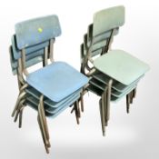Two sets of four 20th century stacking school chairs.