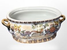 A contemporary oriental porcelain twin-handled planter, width 58cm.
