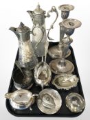 Two 19th-century EPNS-mounted claret jugs, a pair of candlesticks, bottle coaster,