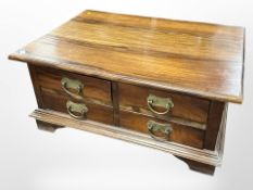 A contemporary hardwood storage coffee table fitted with drawers, 95cm w x 70cm d x 43cm h.