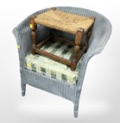 An oak and rattan stool and a loom armchair