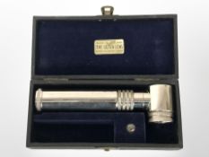 An ophthalmoscope in case.