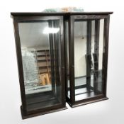 A pair of contemporary glazed mirror back display cabinets with adjustable glass shelves,