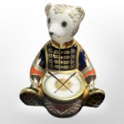 A Royal Crown Derby seated drummer teddy bear paperweight with silver stopper, height 10.5cm.