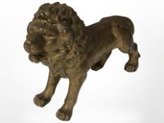 A Victorian gilt metal figure of a lion, length 23cm.