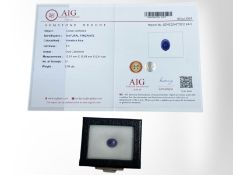 A natural loose tanzanite, violetish blue, oval cabochon, 6.95ct, with AIG certificate.