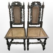 A pair of 19th century heavily carved oak barley twist hall chairs
