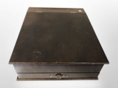 A mahogany writing slope fitted a drawer.