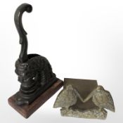 A Victorian cast iron desk stamp in the form of a lion, together with a brass bookend.