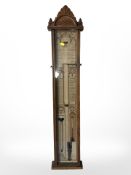 A Victorian carved oak Admiral Fitzroy's barometer, length 107cm.