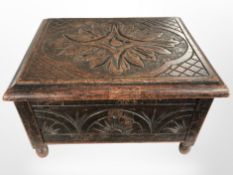 An 19th century carved oak table box, width 36cm.