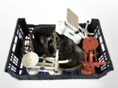 A group of antique enameled scales and a quantity of weights.