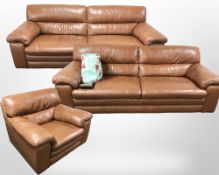 A three piece lounge suite, including two contemporary stitched tan leather three seater settees,