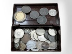 A Bakelite box containing a collection of British and other coins.