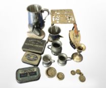A group of vintage tins including Navy Cut, together with brass graduated weights, trivet,