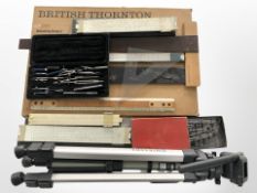 A folding tripod, a group of Thornton logarithmic slide rules,