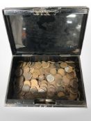 A lacquered cash tin containing assorted Victorian and later pennies and half pennies.