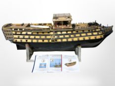 A large scale model of HMS Victory, partially constructed, on metal stand, length 150cm.