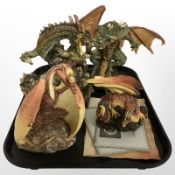 Four Enchantica dragon figurines with boxes.