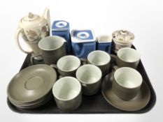 A set of six Denby olive-glazed teacups and saucers, matching milk jug, and other tea wares.
