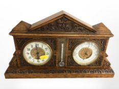 A Victorian carved oak combination mantle clock / thermometer / barometer, width 39cm.
