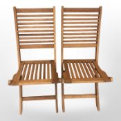 A pair of John Lewis teak folding garden chairs with cushions