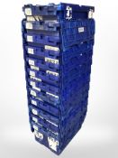 Twelve stackable plastic storage boxes with folding lids,