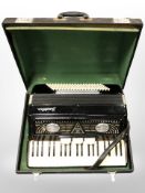 An Italian Frontalini piano accordion in carry case.