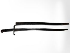 A British Pattern 1863 Whitworth sword bayonet in its steel-mounted leather scabbard,