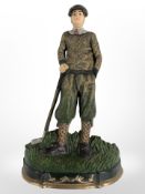 A painted cast-iron doorstop depicting a golfer, height 35cm.