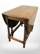 An early 20th century oak barley twist gate leg table, width 90cm.