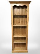 A modern pine open bookcase,