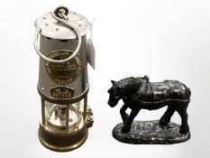 An Eccles SL miners lamp, together with a sculpture of a horse constructed of coal.